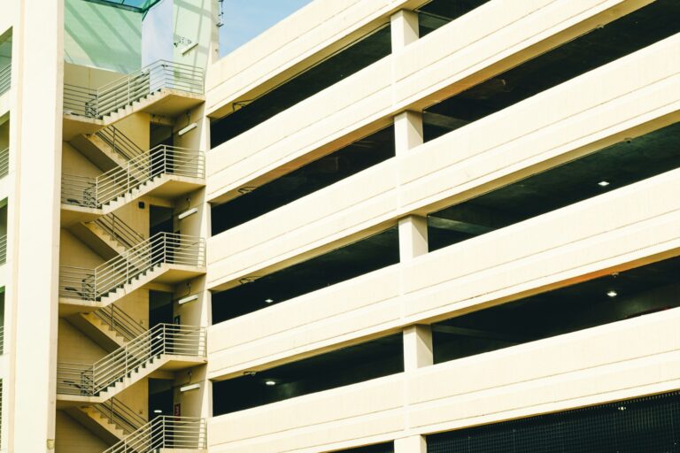 Modern concrete parking garage with exterior stairwell in Singapore